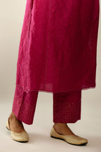 Silk hand crushed kurta set with concealed button placket neckline, highlighted with sequins and scalloped organza at edges.