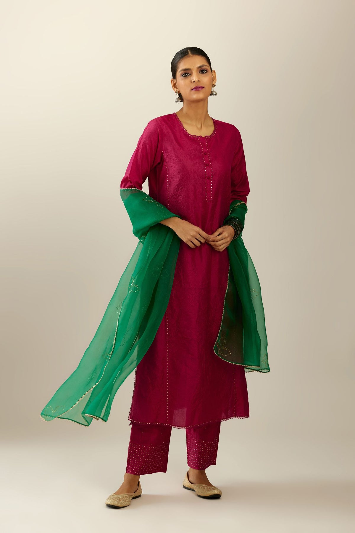 Silk hand crushed kurta set with concealed button placket neckline, highlighted with sequins and scalloped organza at edges.