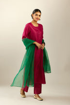 Silk hand crushed kurta set with concealed button placket neckline, highlighted with sequins and scalloped organza at edges.