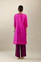 Fiji fuchsia silk hand crushed short kurta set with concealed button placket neckline, highlighted with gold sequins.
