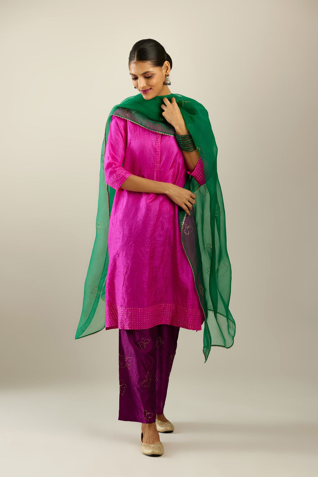 Fiji fuchsia silk hand crushed short kurta set with concealed button placket neckline, highlighted with gold sequins.