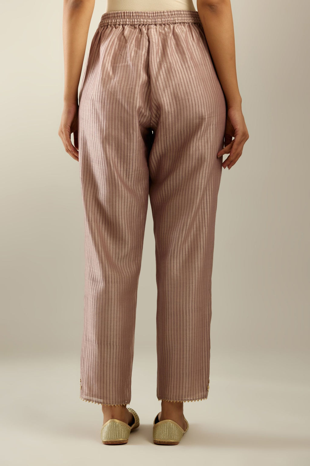 Lilac striped hand block printed silk chanderi pants, highlighted with gota and zari embroidery at hem.