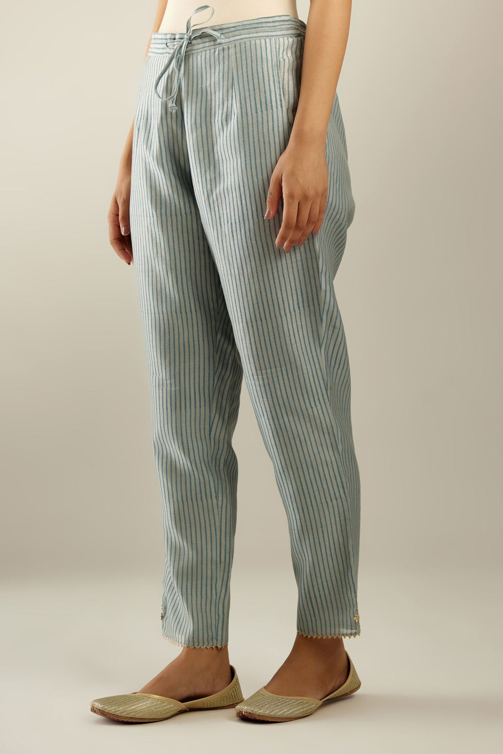 Blue striped hand block printed silk chanderi pants, highlighted with gota and zari embroidery at hem.
