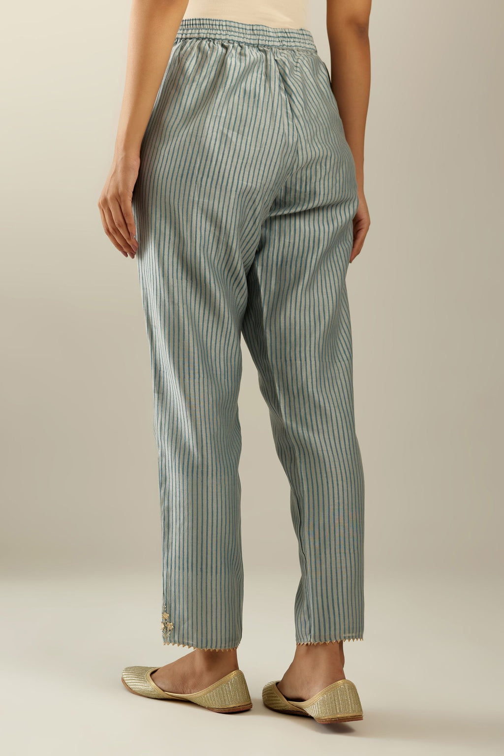 Blue striped hand block printed silk chanderi pants, highlighted with gota and zari embroidery at hem.