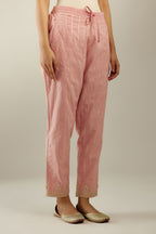 Pink cotton straight pants with all-over gold gota lines and zari embroidery at hem.