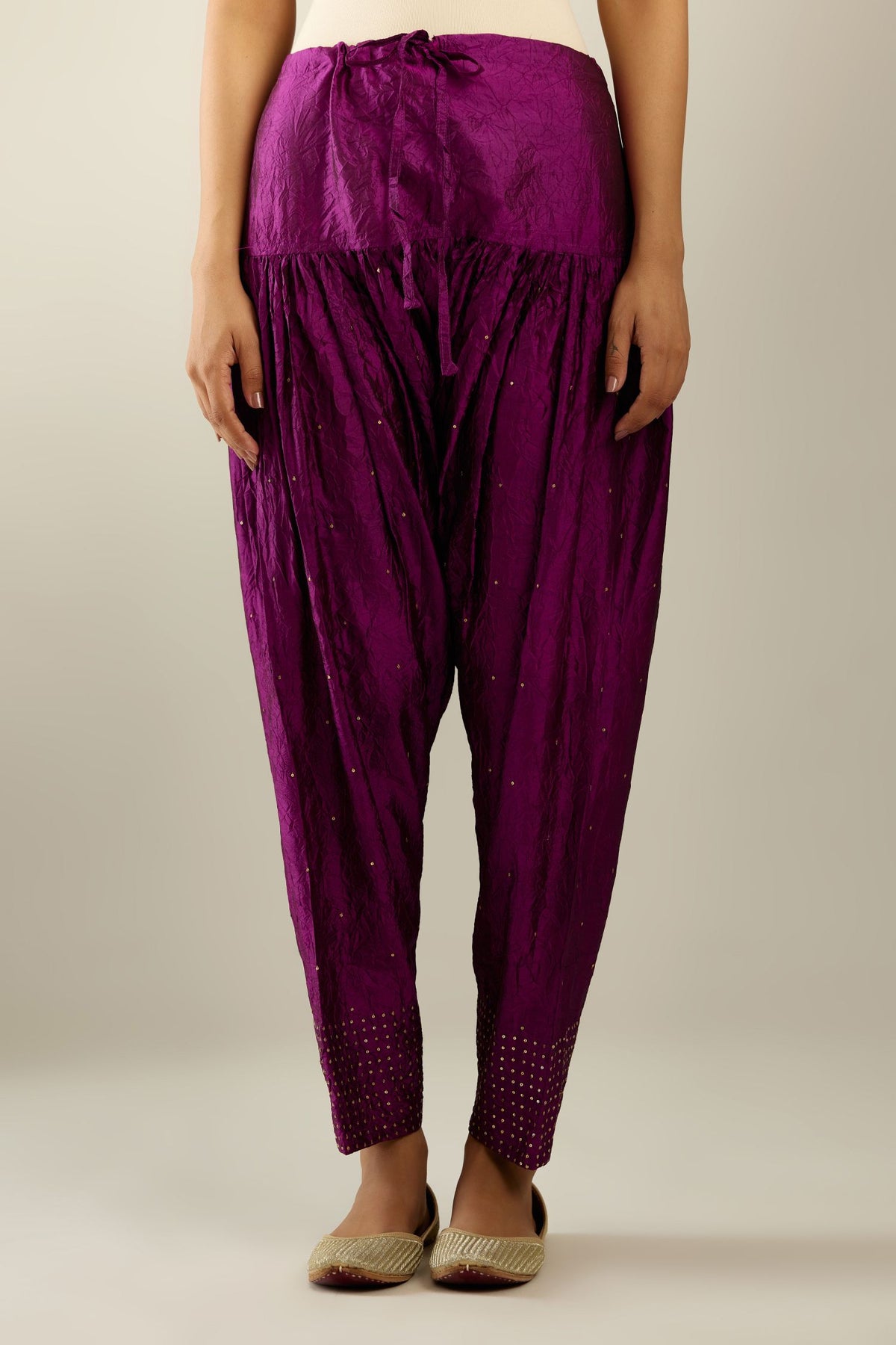 Sangria hand crushed pure silk narrow salwar detailed with gold sequins at hem.
