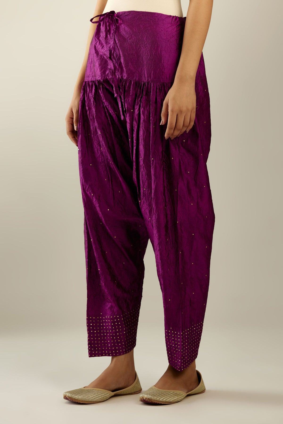 Sangria hand crushed pure silk narrow salwar detailed with gold sequins at hem.