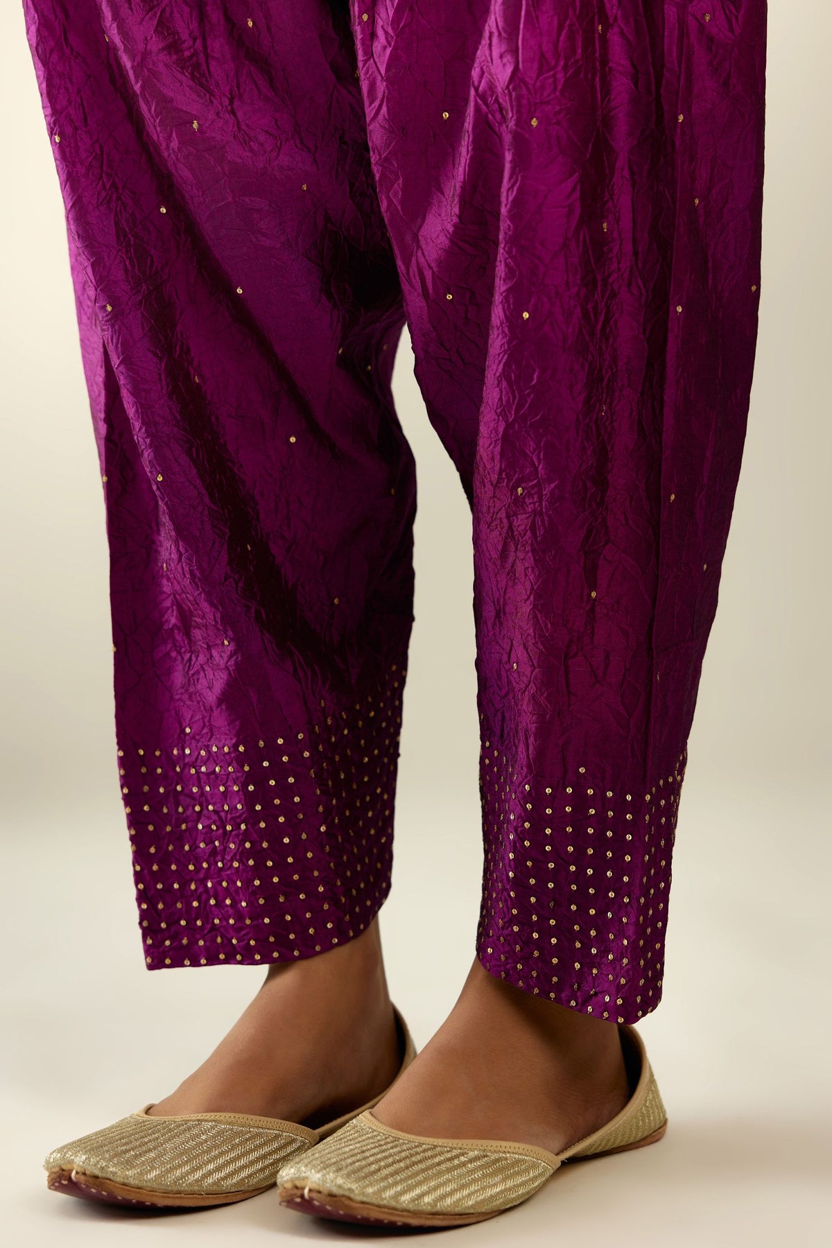 Sangria hand crushed pure silk narrow salwar detailed with gold sequins at hem.