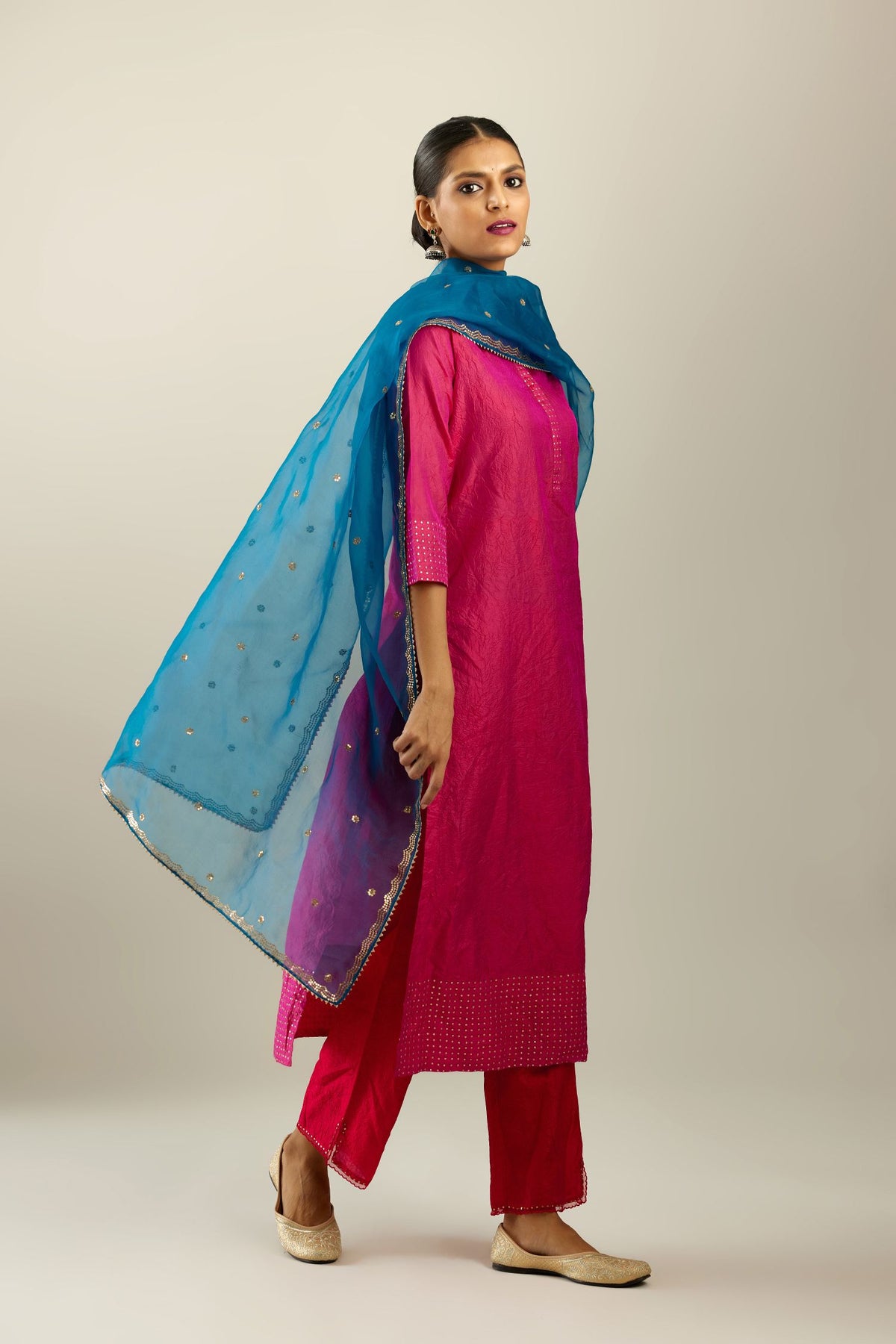 Dark teal silk organza dupatta with golden sequins butis all over with a sequined scalloped edge.
