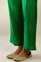 Grass green hand crushed pure silk straight pants with assorted diamond shape golden sequins work till knee length and side pockets.