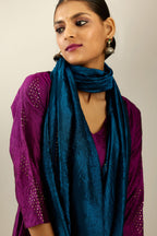 Sangria silk hand crushed A-line kurta set with asymmetric hem, highlighted with all-over gold sequins diamonds.