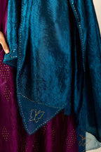 Sangria silk hand crushed A-line kurta set with asymmetric hem, highlighted with all-over gold sequins diamonds.