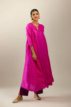Fiji fuchsia hand crushed silk kurta set with asymmetric hem, highlighted with gold sequins and embroidered scalloped organza at edges.