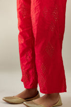 Red hand crushed pure silk straight pants with assorted diamond shape golden sequins work till knee length and side pockets.