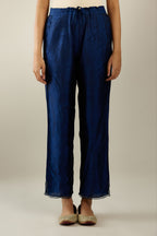 Navy blue hand crushed silk straight pants with scalloped and embroidered organza at edges and detailed with a single line of sequins at hem