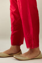 Red hand crushed silk straight pants with scalloped and embroidered organza at edges and detailed with a single line of sequins at hem