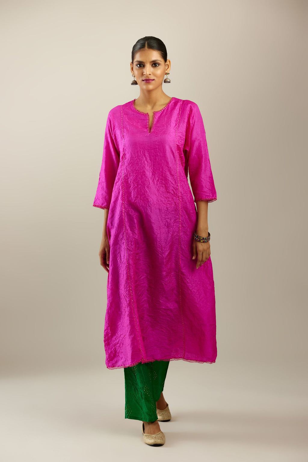 Silk hand crushed A-line kurta set, highlighted with gold sequins and embroidered scalloped edges.