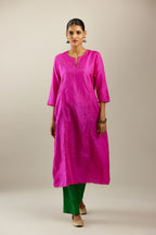 Silk hand crushed A-line kurta set, highlighted with gold sequins and embroidered scalloped edges.