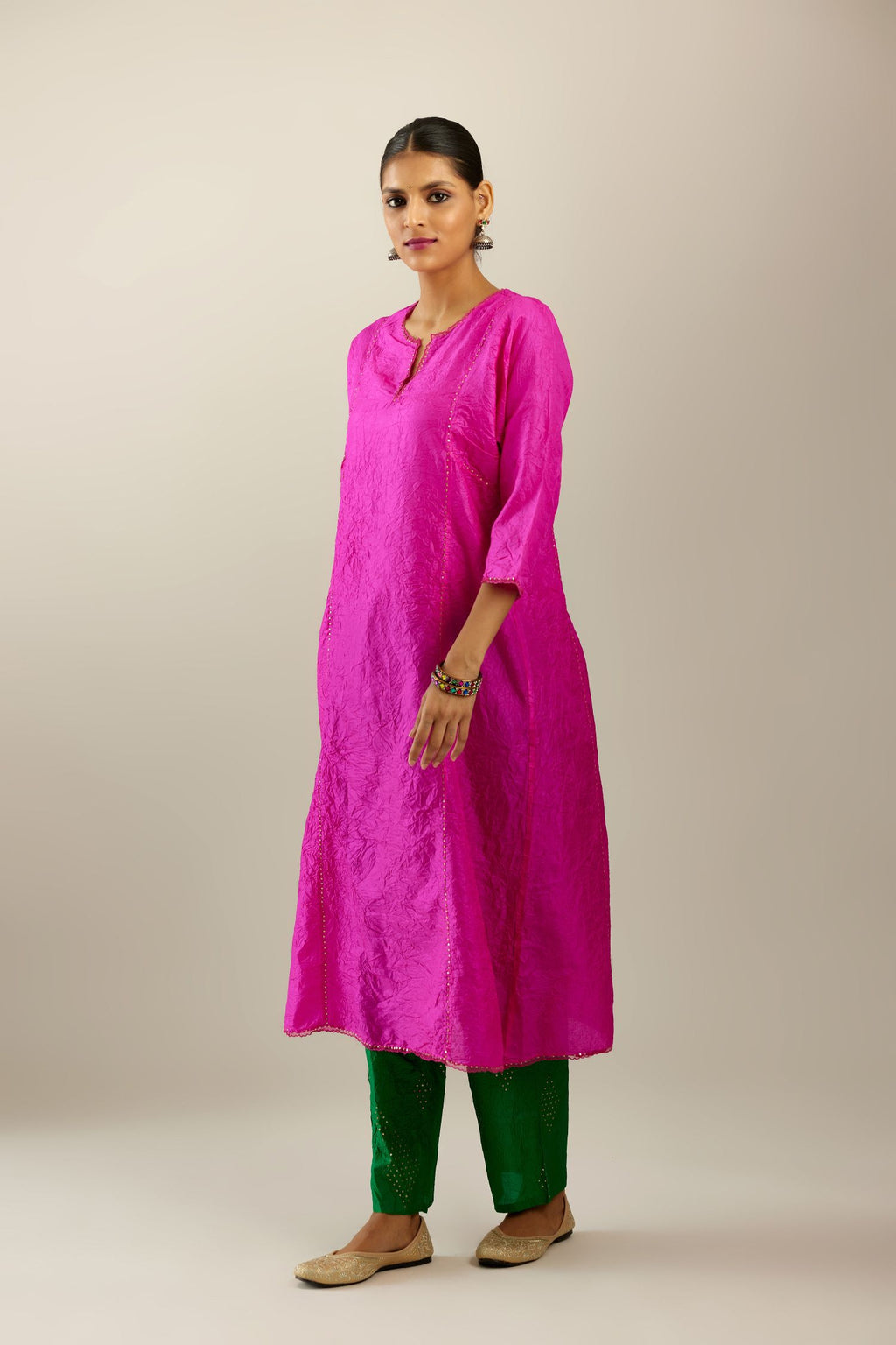 Silk hand crushed A-line kurta set, highlighted with gold sequins and embroidered scalloped edges.