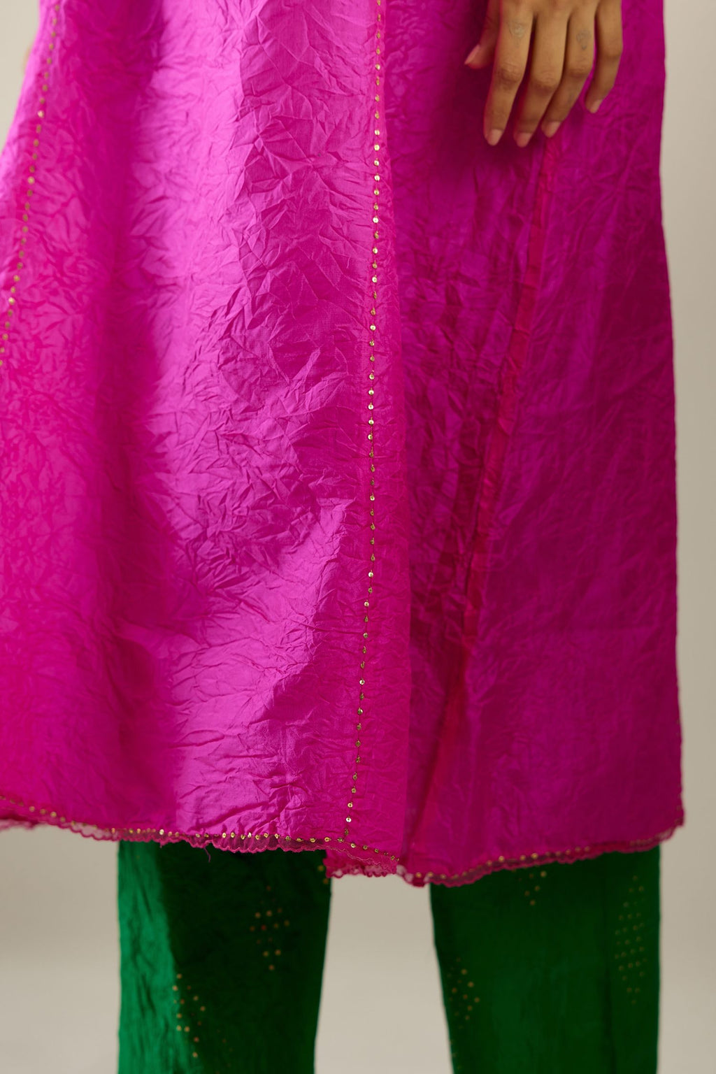 Silk hand crushed A-line kurta set, highlighted with gold sequins and embroidered scalloped edges.