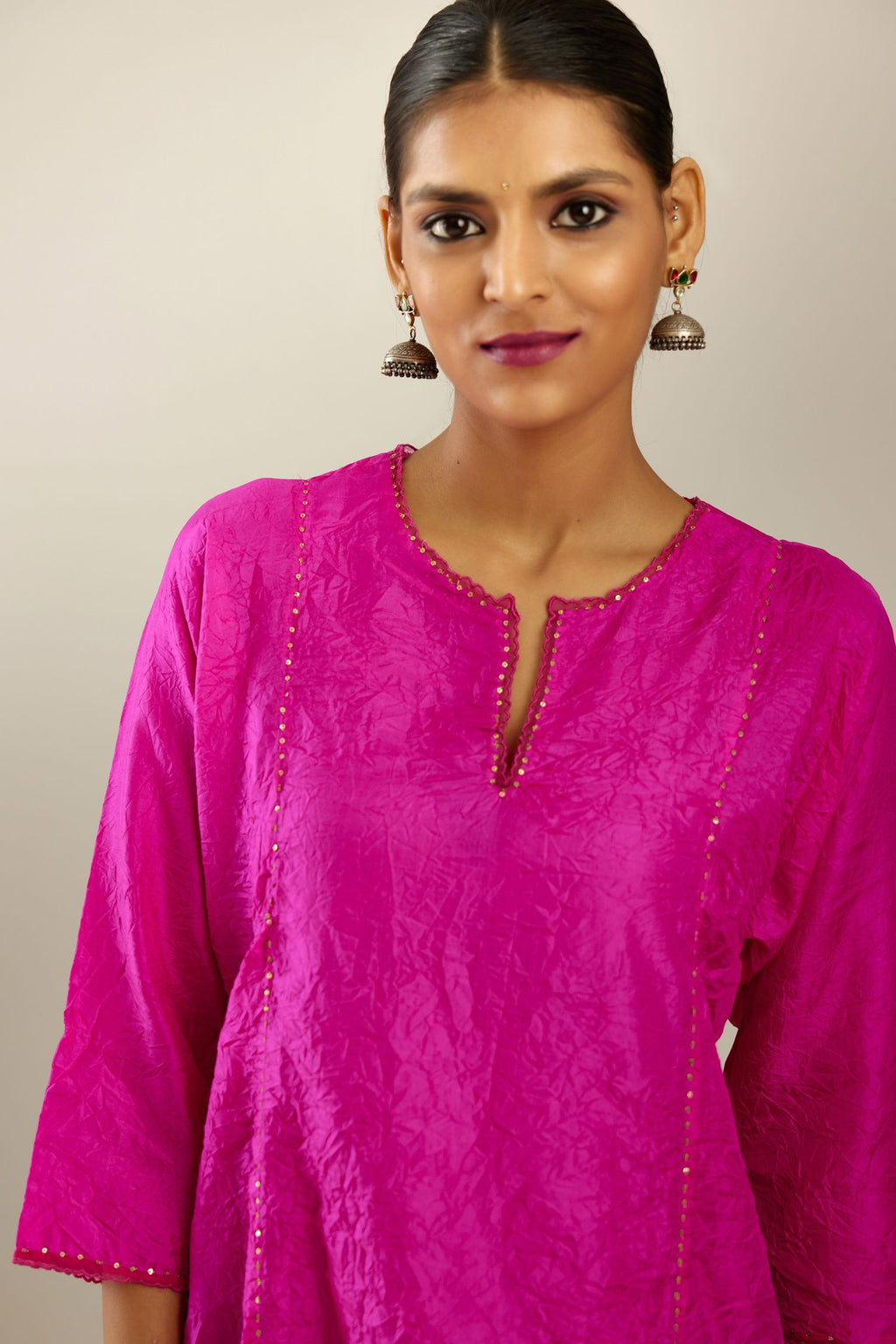 Silk hand crushed A-line kurta set, highlighted with gold sequins and embroidered scalloped edges.
