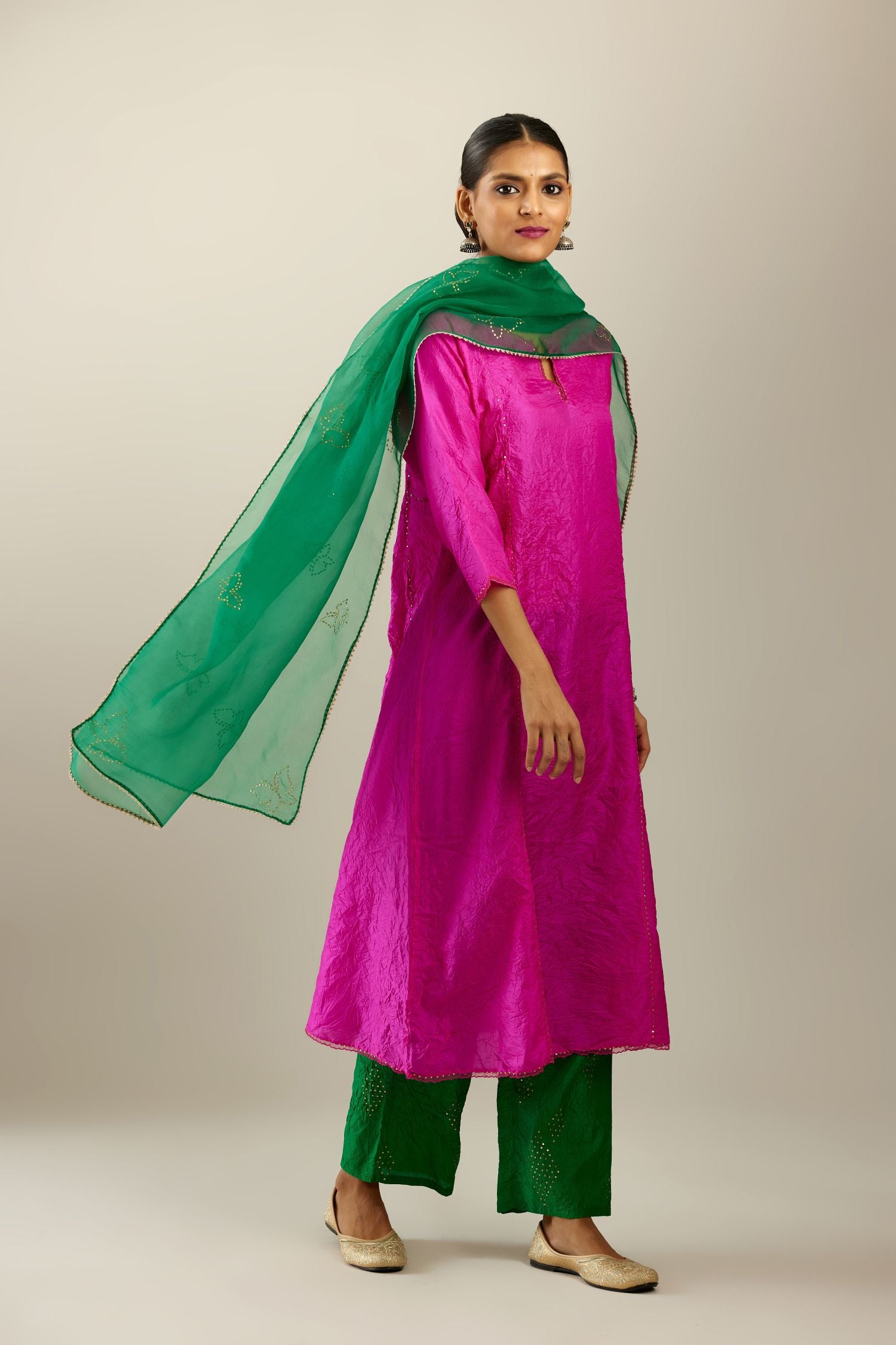 Silk hand crushed A-line kurta set, highlighted with gold sequins and embroidered scalloped edges.
