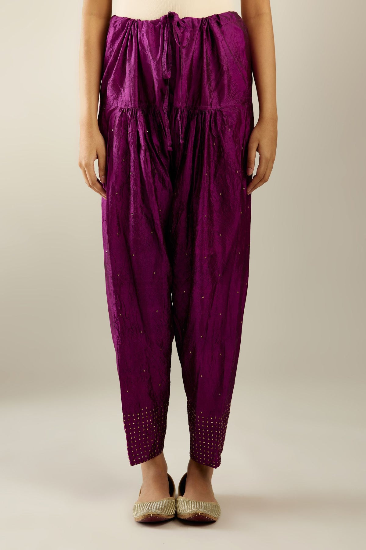 Sangria hand crushed pure silk narrow salwar detailed with gold sequins at hem.