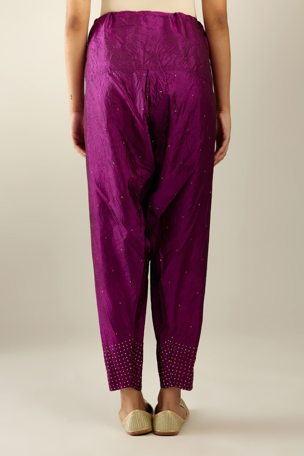 Sangria hand crushed pure silk narrow salwar detailed with gold sequins at hem.