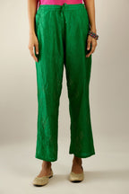Grass green hand crushed pure silk straight pants with assorted diamond shape golden sequins work till knee length and side pockets.