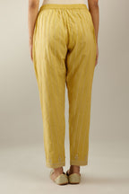 Yellow cotton straight pants with all-over gold gota lines and zari embroidery at hem.
