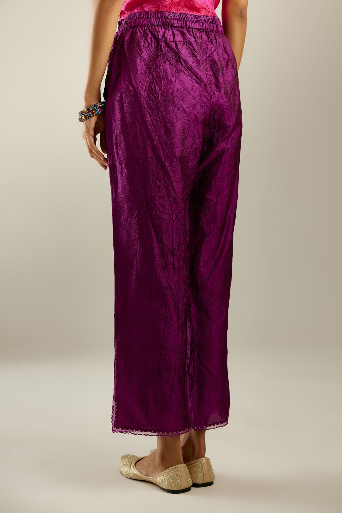 Sangria hand crushed silk straight pants with scalloped and embroidered organza at edges and detailed with a single line of sequins at hem