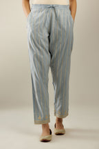 Blue cotton straight pants with all-over gold gota lines and zari embroidery at hem.