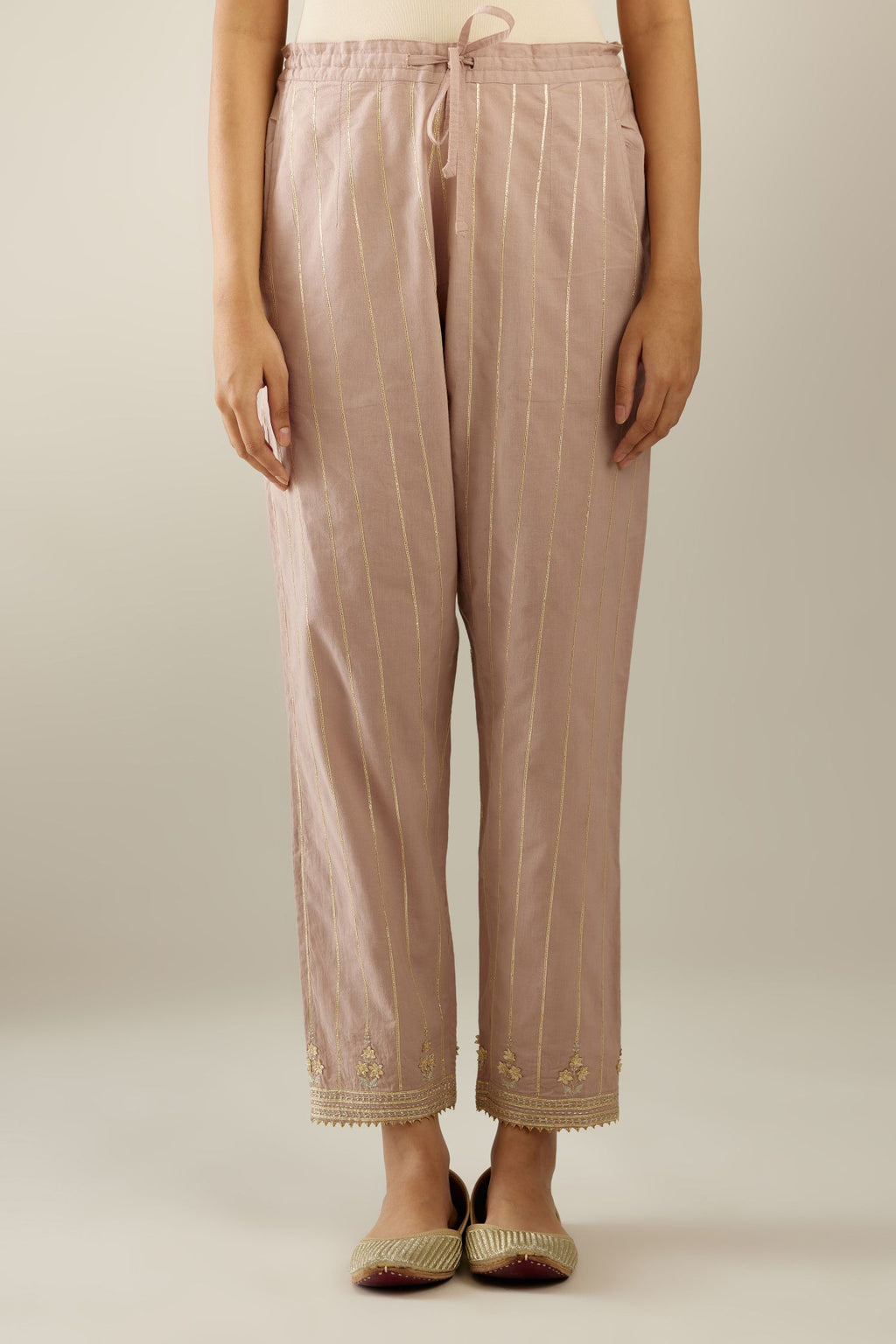 Lilac cotton straight pants with all-over gold gota lines and zari embroidery at hem.