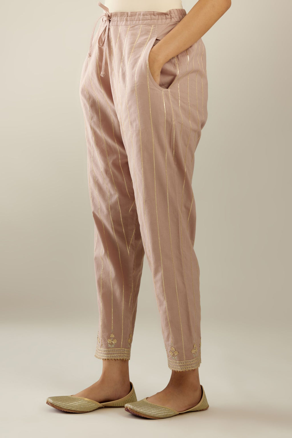 Lilac cotton straight pants with all-over gold gota lines and zari embroidery at hem.