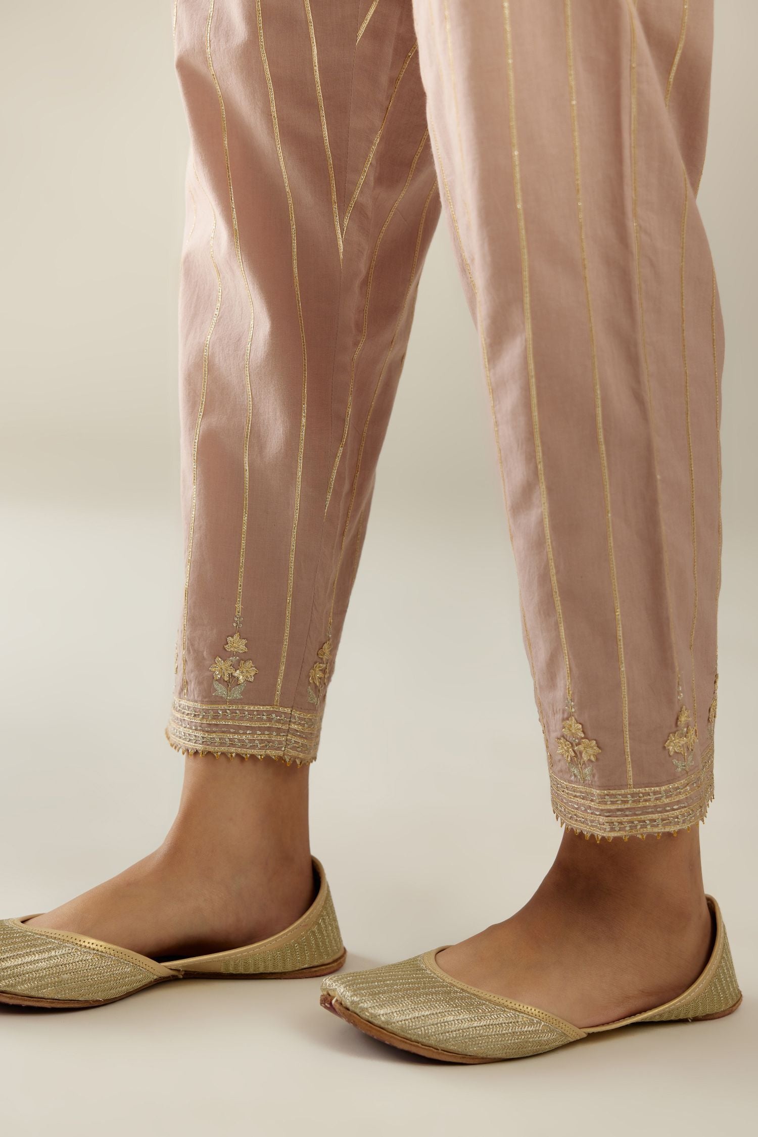 Lilac cotton straight pants with all-over gold gota lines and zari embroidery at hem.