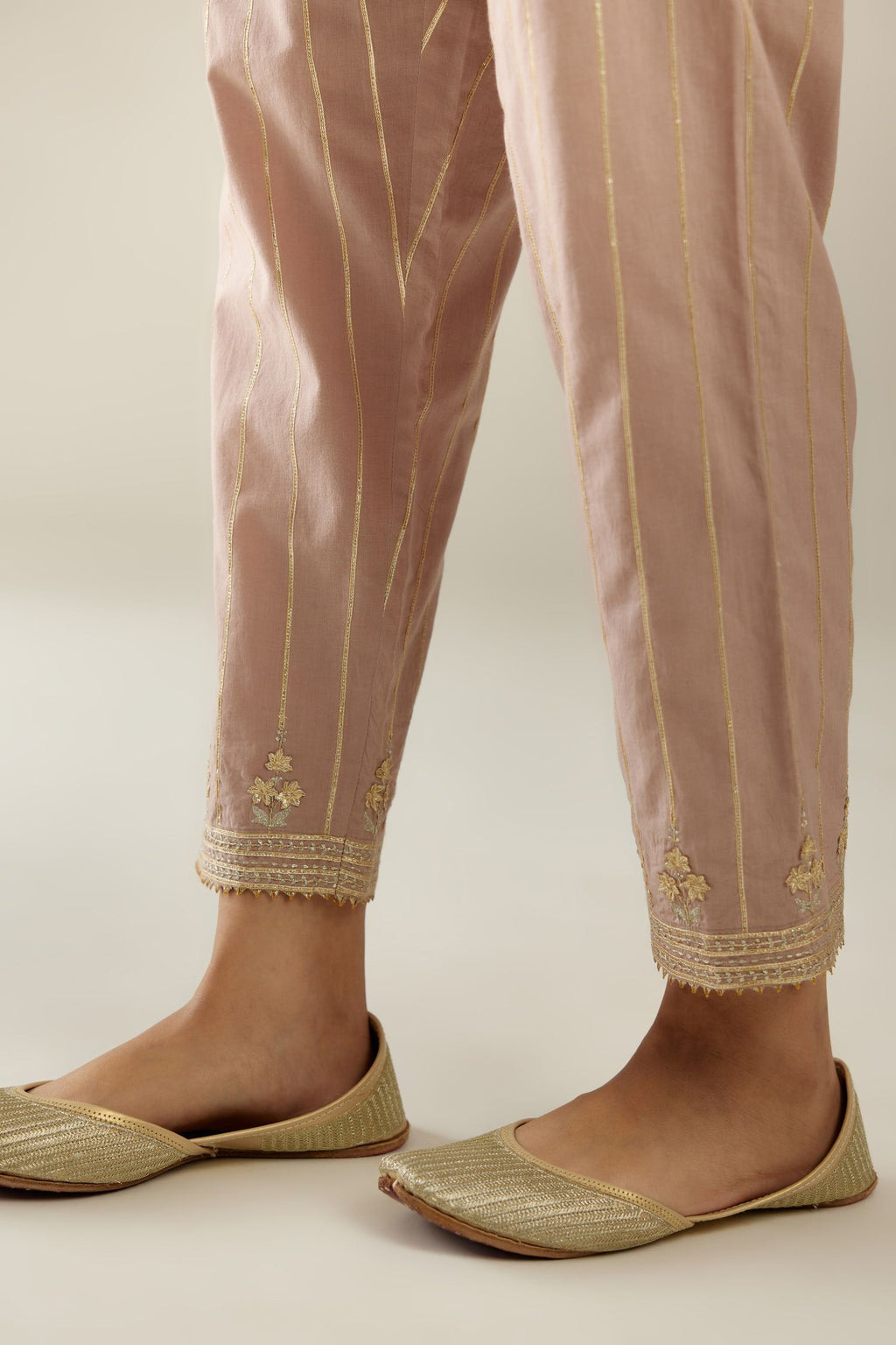 Lilac cotton straight pants with all-over gold gota lines and zari embroidery at hem.