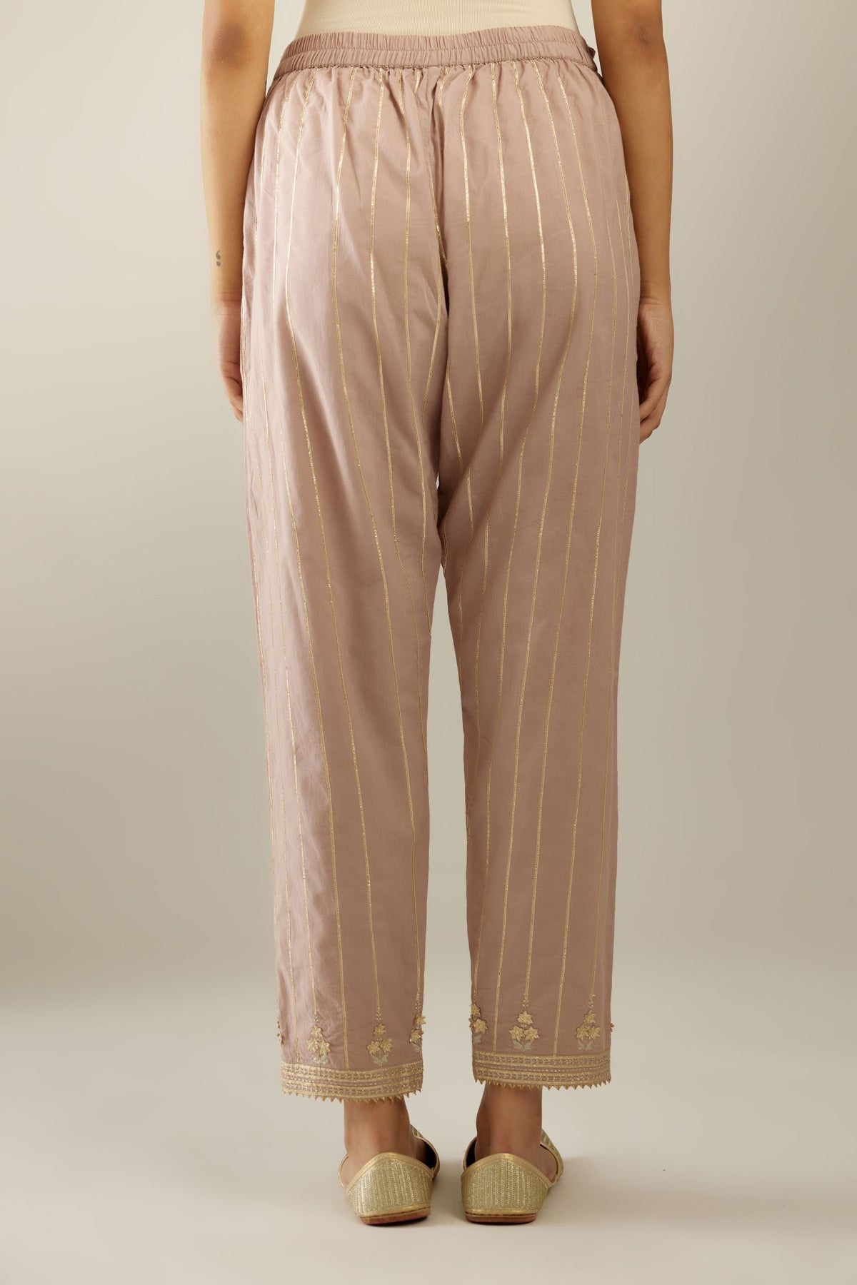 Lilac cotton straight pants with all-over gold gota lines and zari embroidery at hem.