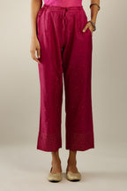 Jazzberry jam hand crushed silk straight pants detailed with gold sequins at hem and a single sequin buti is sprayed all over the pants and side pockets