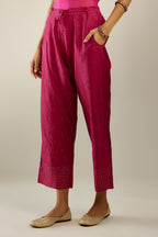 Jazzberry jam hand crushed silk straight pants detailed with gold sequins at hem and a single sequin buti is sprayed all over the pants and side pockets