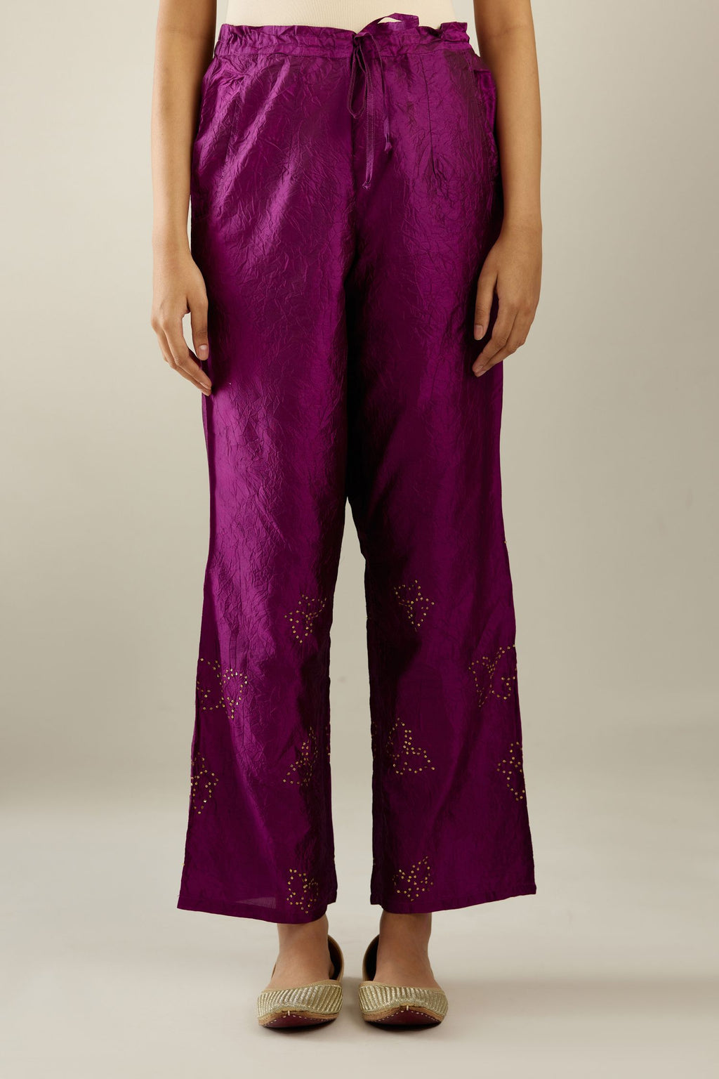 Sangria hand crushed silk pants with side pockets and assorted sequined butterflies till mid-calf length.