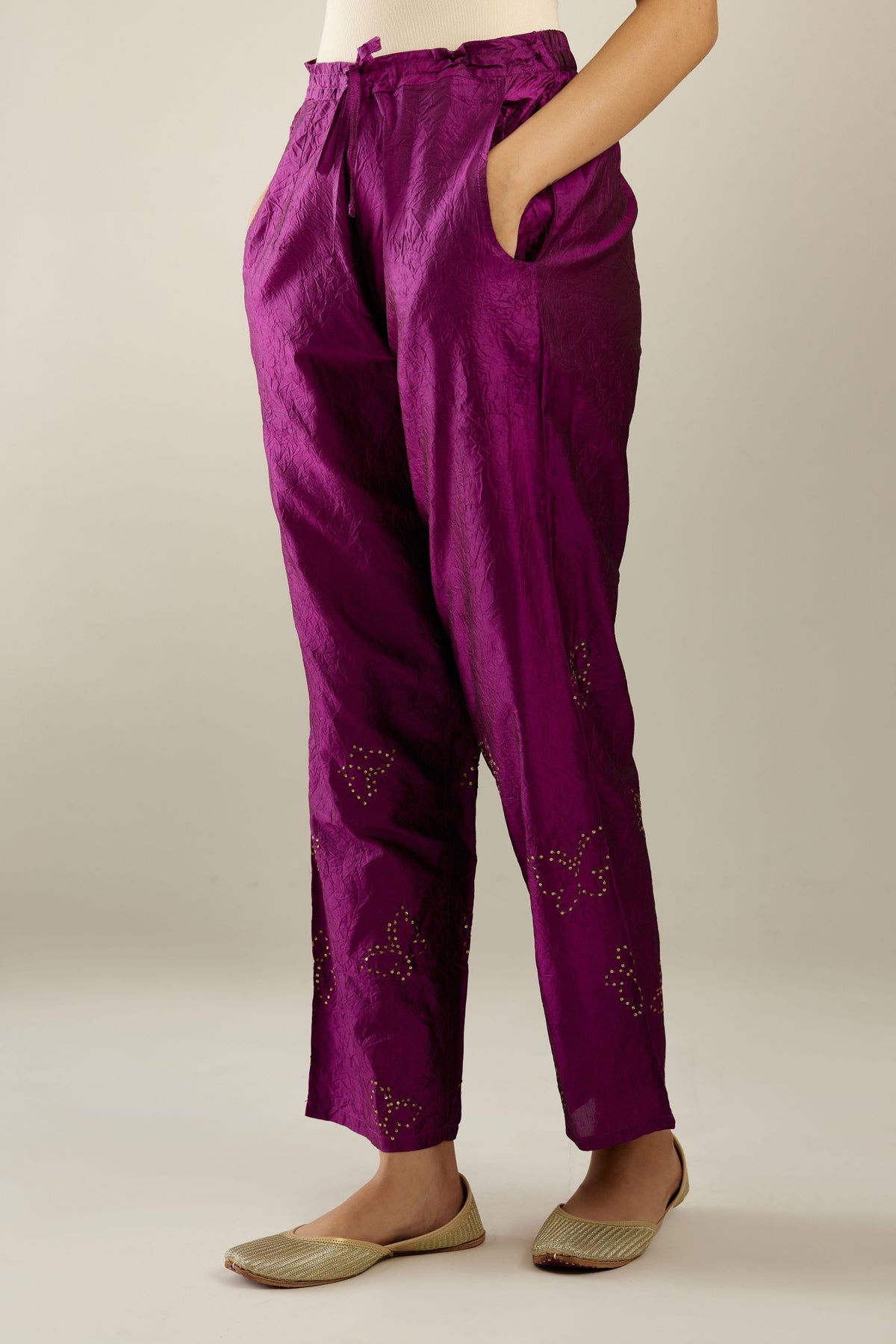 Sangria hand crushed silk pants with side pockets and assorted sequined butterflies till mid-calf length.