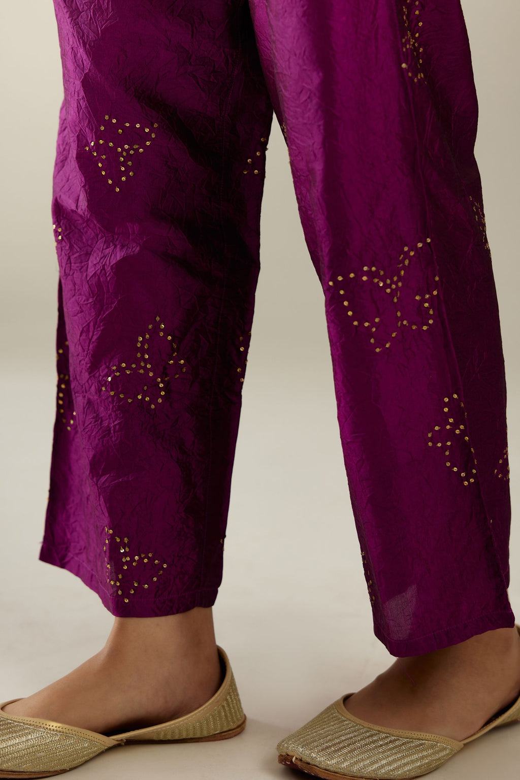 Sangria hand crushed silk pants with side pockets and assorted sequined butterflies till mid-calf length.