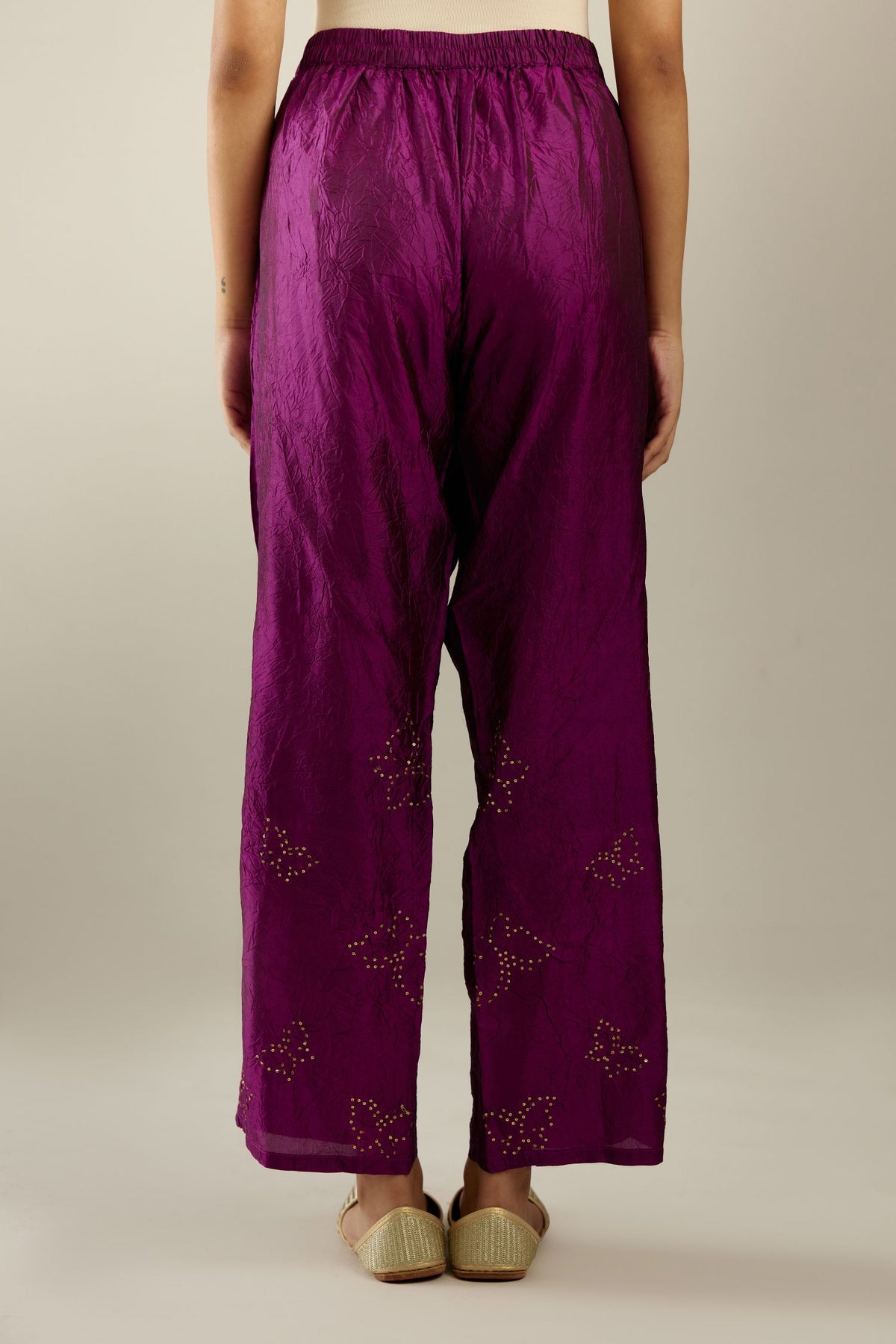 Sangria hand crushed silk pants with side pockets and assorted sequined butterflies till mid-calf length.