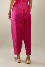Raspberry hand crushed pure silk narrow salwar detailed with gold sequins at hem.