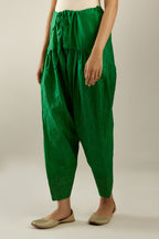 Grass green hand crushed pure silk narrow salwar detailed with gold sequins at hem.