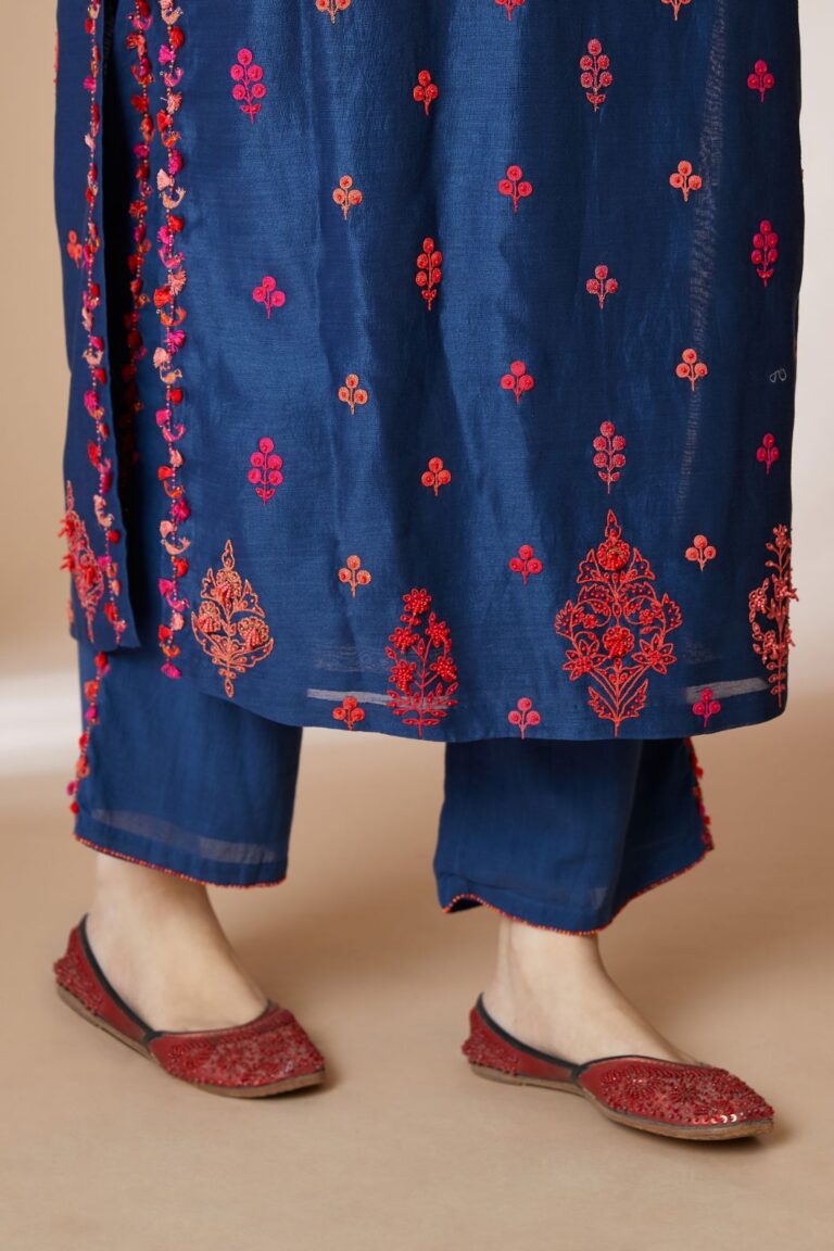 Indigo blue straight kurta set with all-over multi coloured Dori embroidery and delicate bird and tassel detailing at neck and side slits