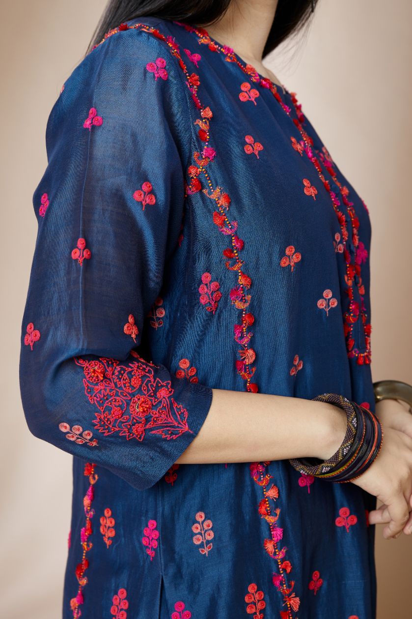 Indigo blue straight kurta set with all-over multi coloured Dori embroidery and delicate bird and tassel detail at side panel joint seams