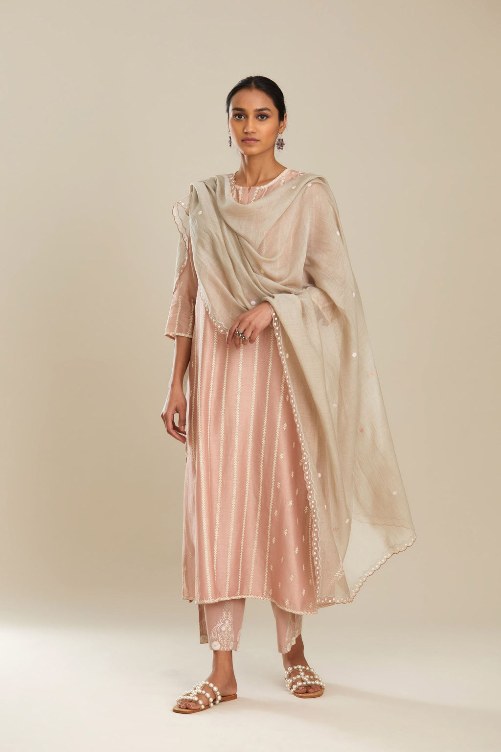 Old rose silk chanderi kurta set with striped embroidery in central panel and embroidered bootis at side panels.