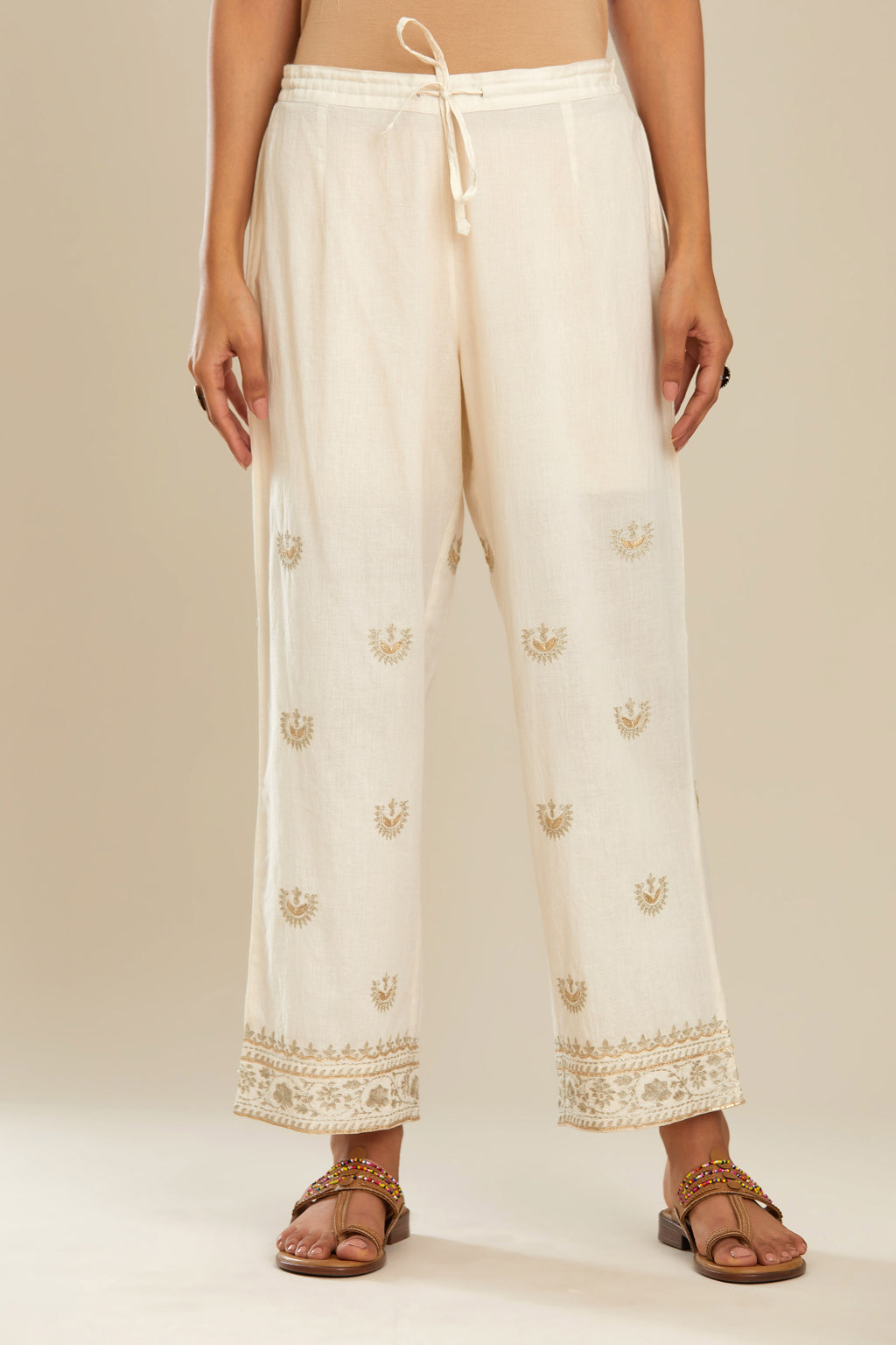 Off white cotton straight pants with gold gota and zari embroidery