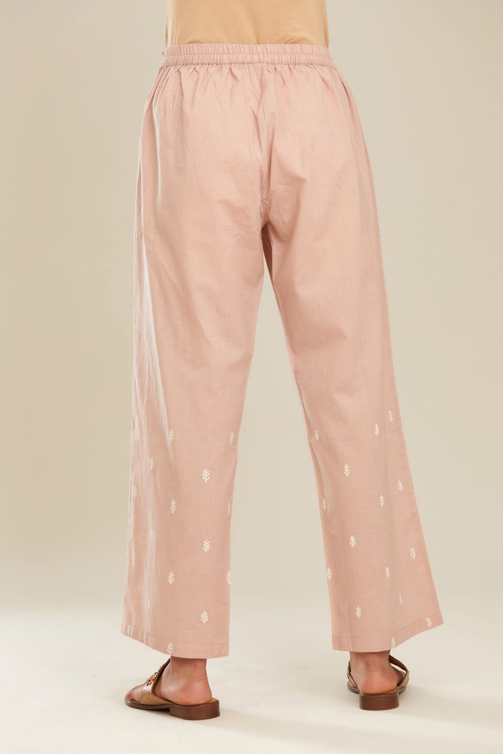 Old rose cotton straight pants with small booti embroidery.